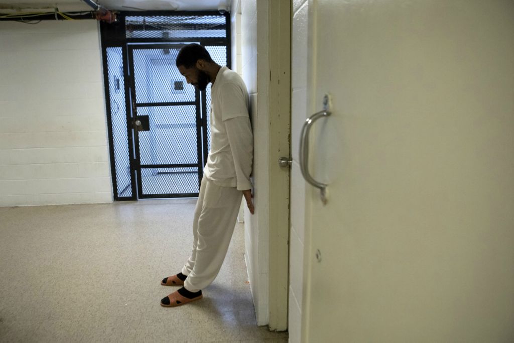 First Place, News Picture Story - Jessica Phelps / Newark Advocate, “Life Locked Up in the County Jail”Zachary Grimmett-Anderson waits in a hallways at the Coshocton County Justice Center to talk with one of the guards November 27, 2020. The jail has no money for any programs so inmates are often left to their own devices, just wandering the hall or playing a game of cards. 